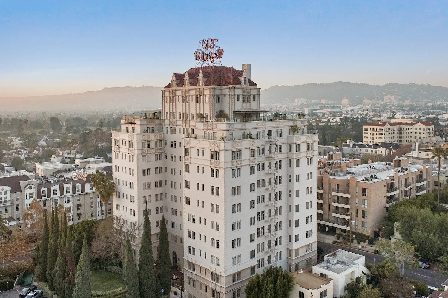 El Royale — iconic building exterior with rooftop sign against blue sky