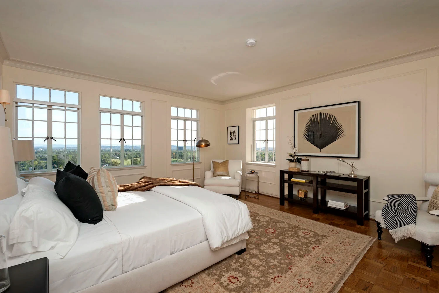 El Royale — bedroom with panoramic windows and landscaped views