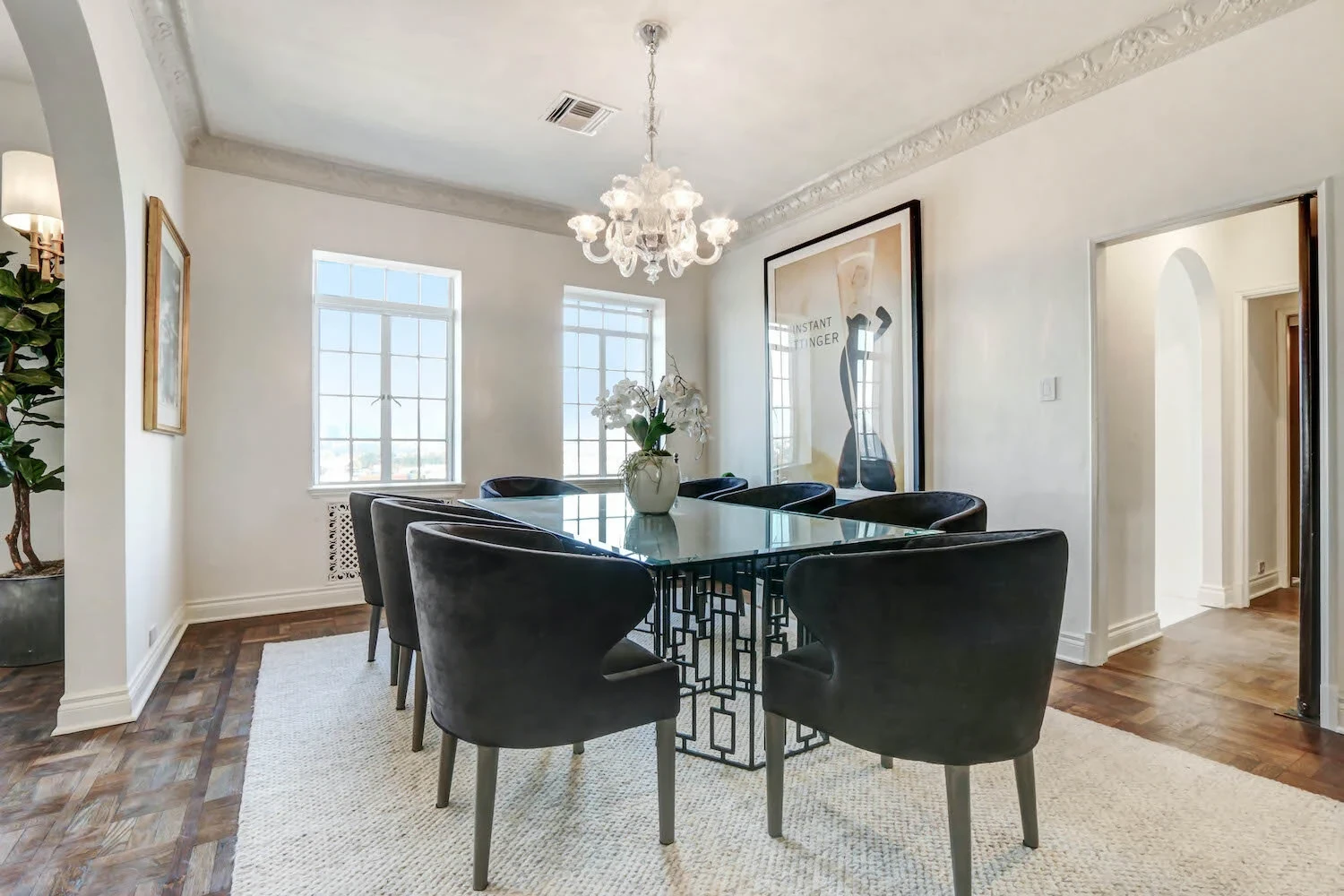 El Royale — formal dining room with glass table and velvet chairs